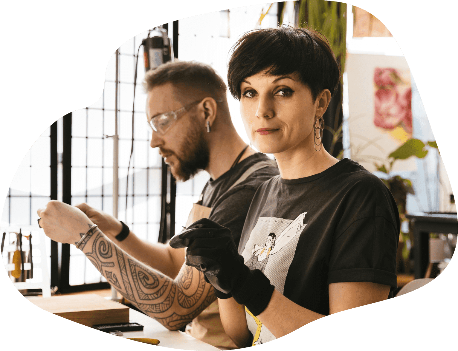 Man and woman working with their hands at a table